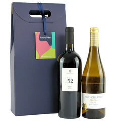Two wine bottles with a gift box labeled 'Reserve Wines' on a white background