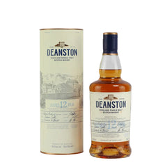 A bottle of Deanston 12yo Highland single malt Scotch whisky in front of its packaging box. The bottle has a beige label with the Deanston branding and a signature on the label.